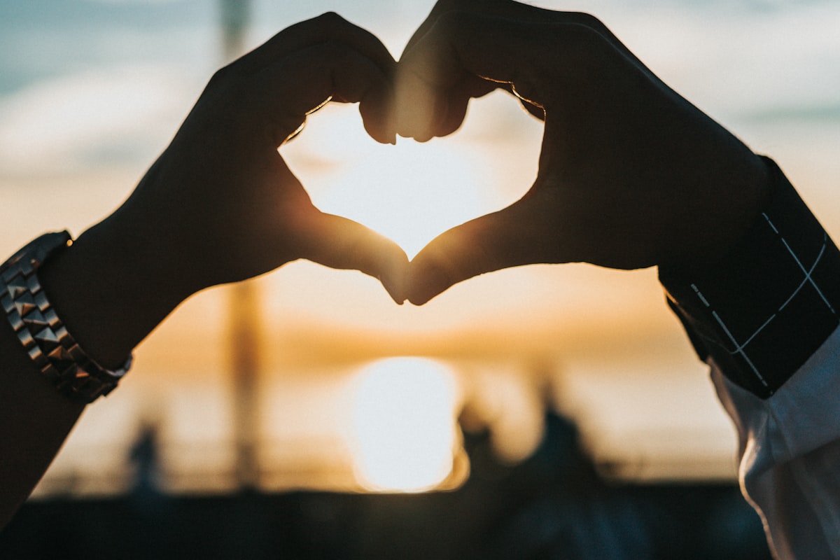 Couple signing wedding paperwork after an online ceremony